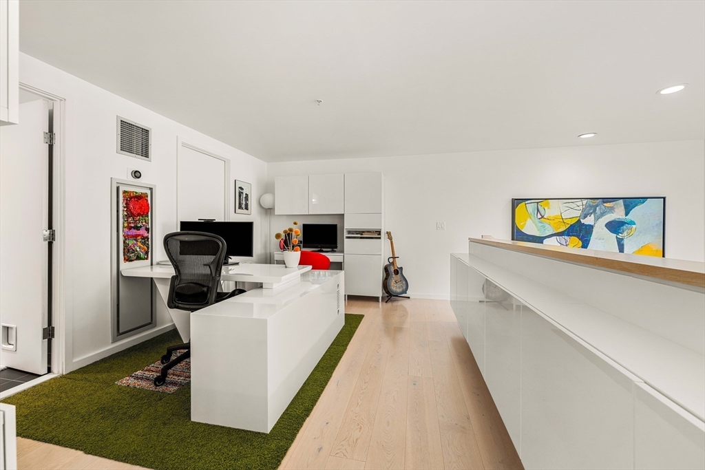 1 Earhart Street, Unit 705 Cambridge, MA 02141 - Photo 19 of 38 a living room with furniture and a table