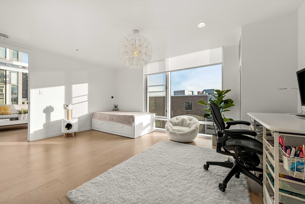 1 Earhart Street, Unit 705 Cambridge, MA 02141 - Photo 21 of 38 a living room with furniture and a large window