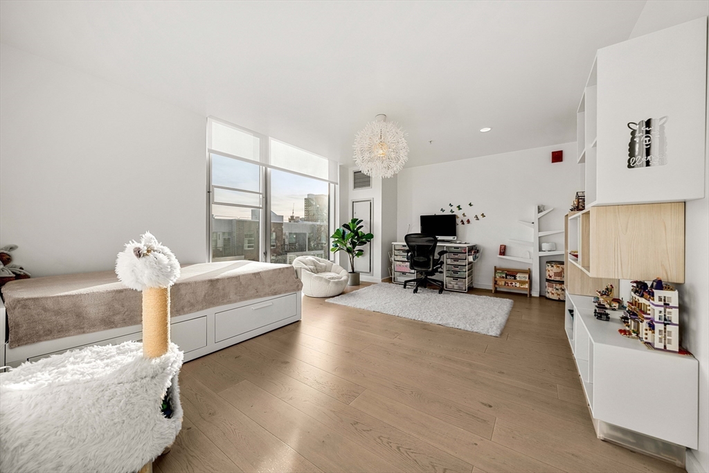 1 Earhart Street, Unit 705 Cambridge, MA 02141 - Photo 22 of 38 a living room with furniture and a large window