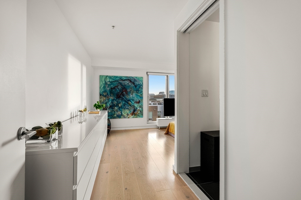 1 Earhart Street, Unit 705 Cambridge, MA 02141 - Photo 24 of 38 a view of a living room with windows
