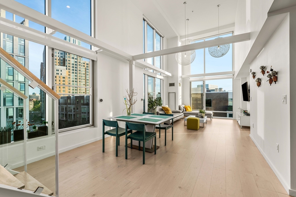 1 Earhart Street, Unit 705 Cambridge, MA 02141 - Photo 3 of 38 a view of a patio with table and chairs