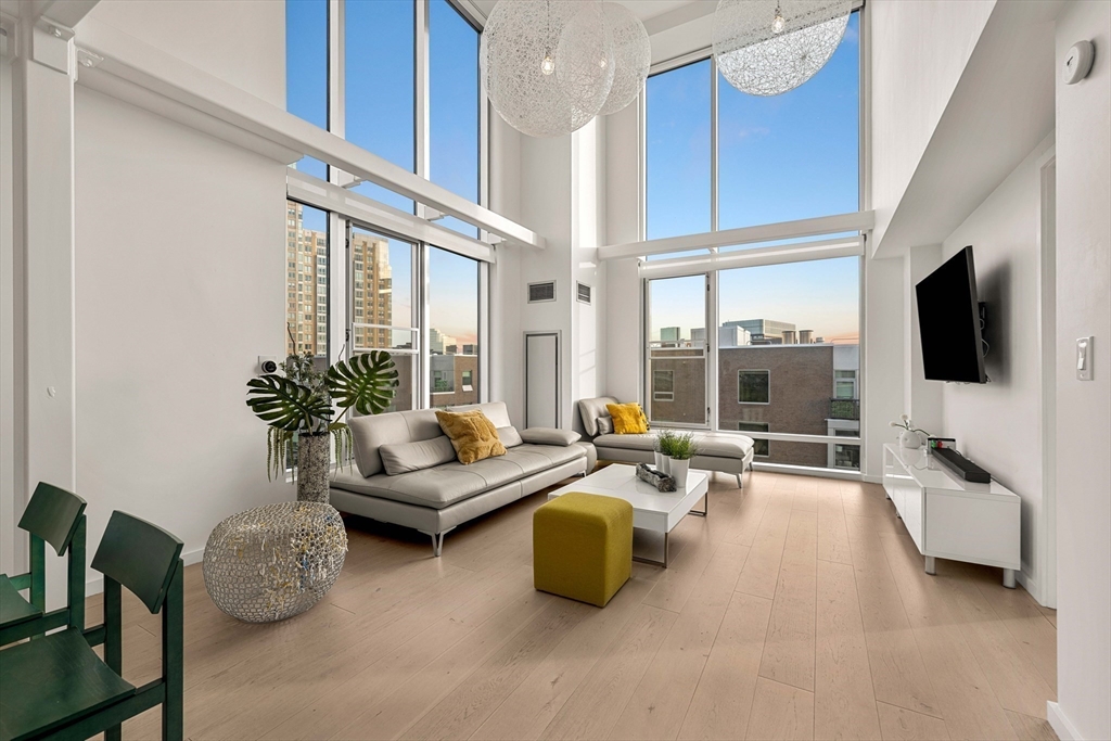 1 Earhart Street, Unit 705 Cambridge, MA 02141 - Photo 33 of 38 a living room with furniture and a flat screen tv