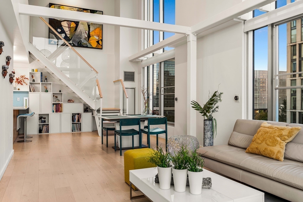 1 Earhart Street, Unit 705 Cambridge, MA 02141 - Photo 5 of 38 a living room with furniture and wooden floor