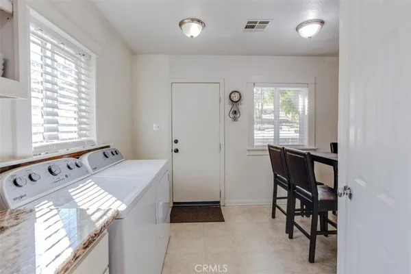 a bathroom with a bathtub and a window
