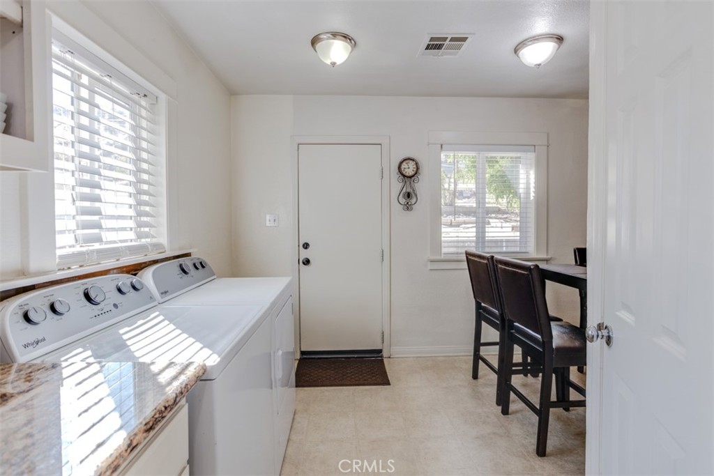 15461 Hesperia Road Victorville, CA 92395 - Photo 15 of 28 a bathroom with a bathtub and a window