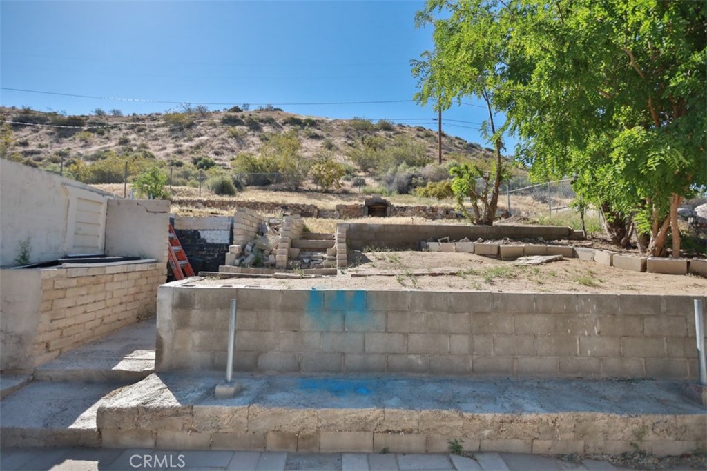 15461 Hesperia Road Victorville, CA 92395 - Photo 20 of 28 a view of a swimming pool with a patio