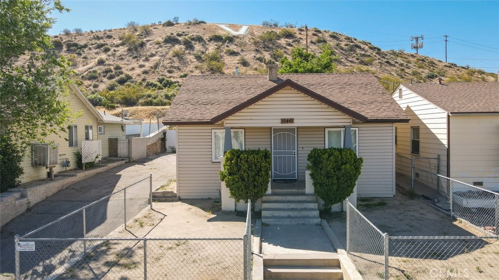 15461 Hesperia Road Victorville, CA 92395 - Photo 2 of 28 a view of a house with backyard and sitting area