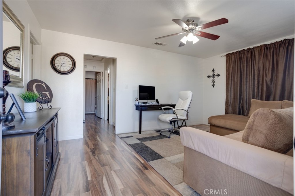 15461 Hesperia Road Victorville, CA 92395 - Photo 3 of 28 a living room with furniture and a flat screen tv