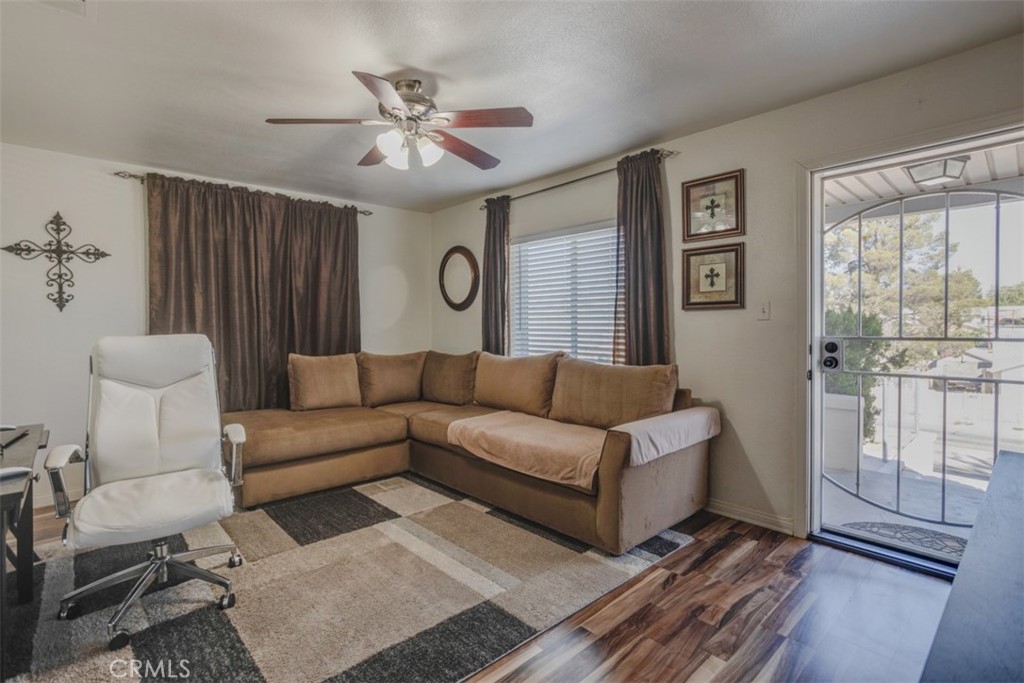 15461 Hesperia Road Victorville, CA 92395 - Photo 4 of 28 a living room with furniture and a large window