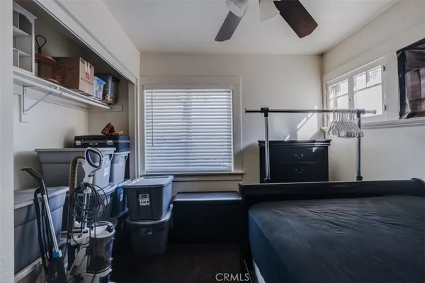 a bedroom with furniture and a window