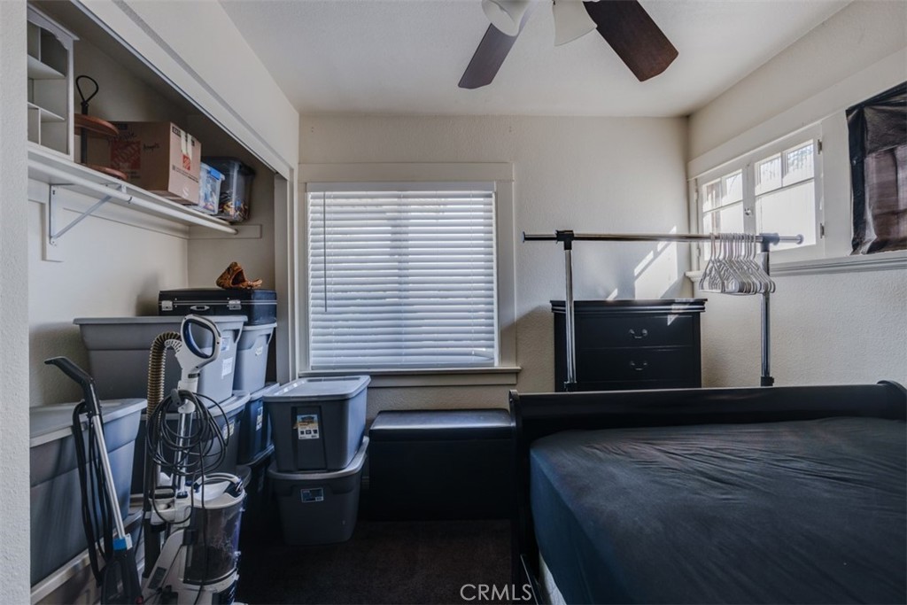 15461 Hesperia Road Victorville, CA 92395 - Photo 7 of 28 a bedroom with furniture and a window