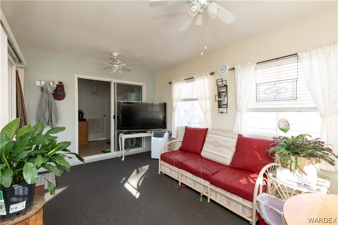 4102 Cibola Road Golden Valley, AZ 86413 - Photo 33 of 71 a living room with furniture and a flat screen tv