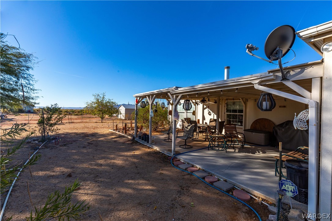 4102 Cibola Road Golden Valley, AZ 86413 - Photo 39 of 71 a view of a patio with a table and chairs