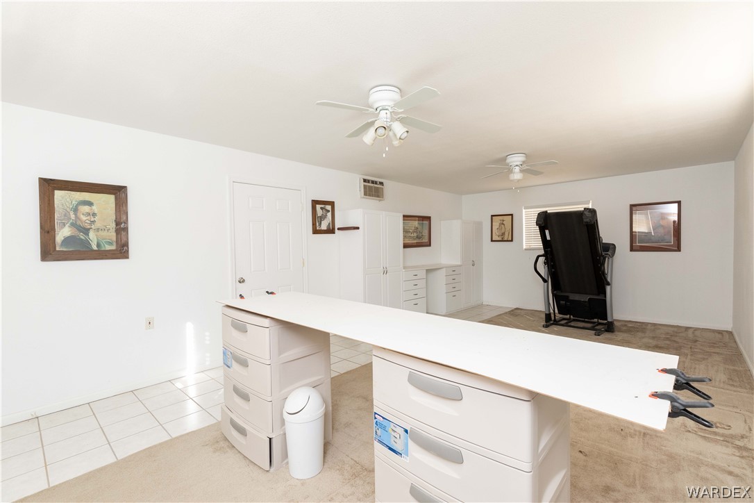 4102 Cibola Road Golden Valley, AZ 86413 - Photo 49 of 71 a room with a table chairs and wooden floor