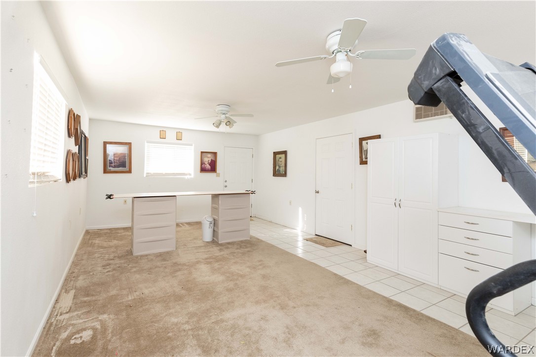 4102 Cibola Road Golden Valley, AZ 86413 - Photo 53 of 71 a view of a livingroom with furniture and ceiling fan