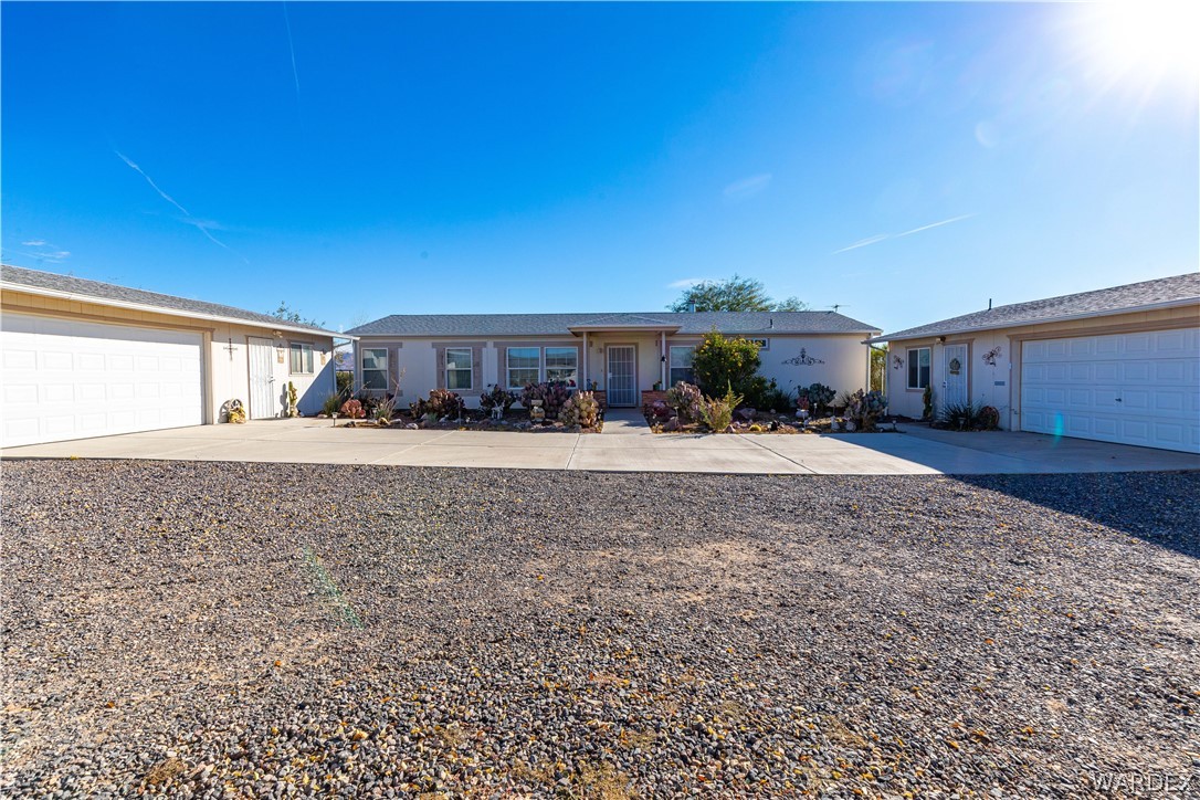 4102 Cibola Road Golden Valley, AZ 86413 - Photo 6 of 71 a view of house with a yard