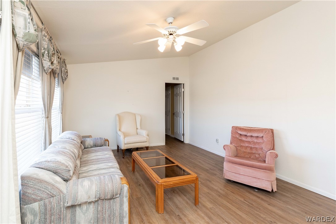 4102 Cibola Road Golden Valley, AZ 86413 - Photo 7 of 71 a living room with furniture and a window