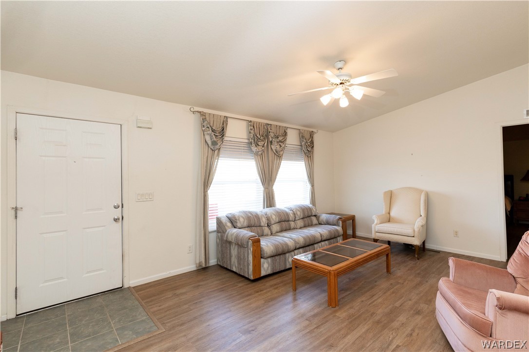4102 Cibola Road Golden Valley, AZ 86413 - Photo 8 of 71 a living room with furniture and a large window