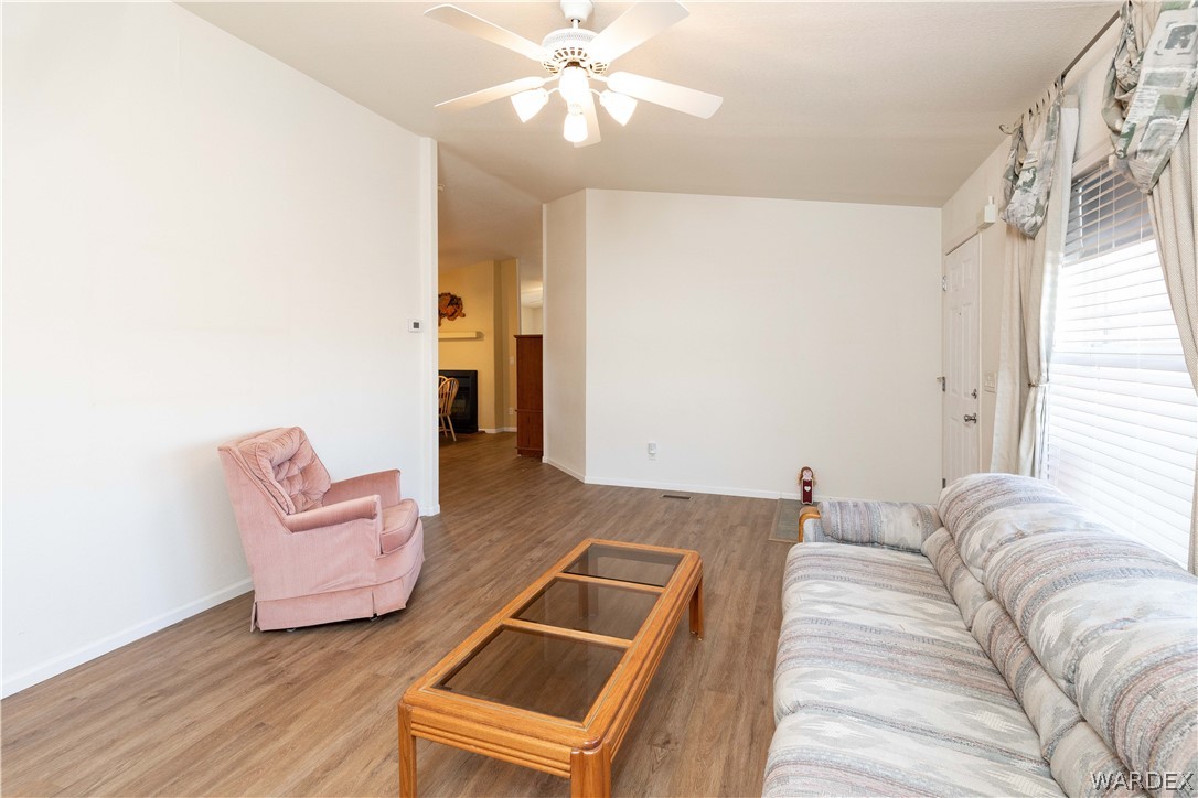 4102 Cibola Road Golden Valley, AZ 86413 - Photo 10 of 71 a living room with furniture and a chandelier