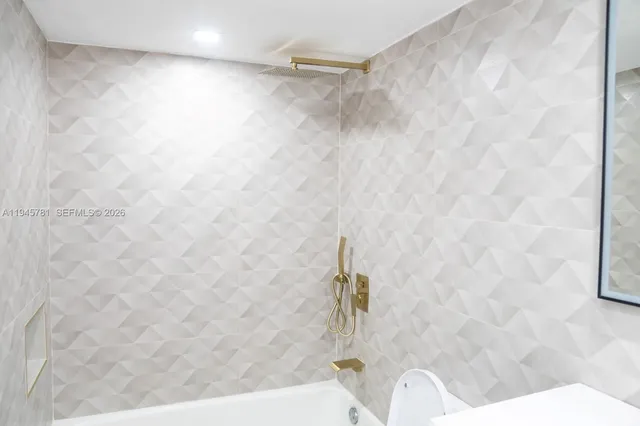 a bath tub sitting in a bathroom