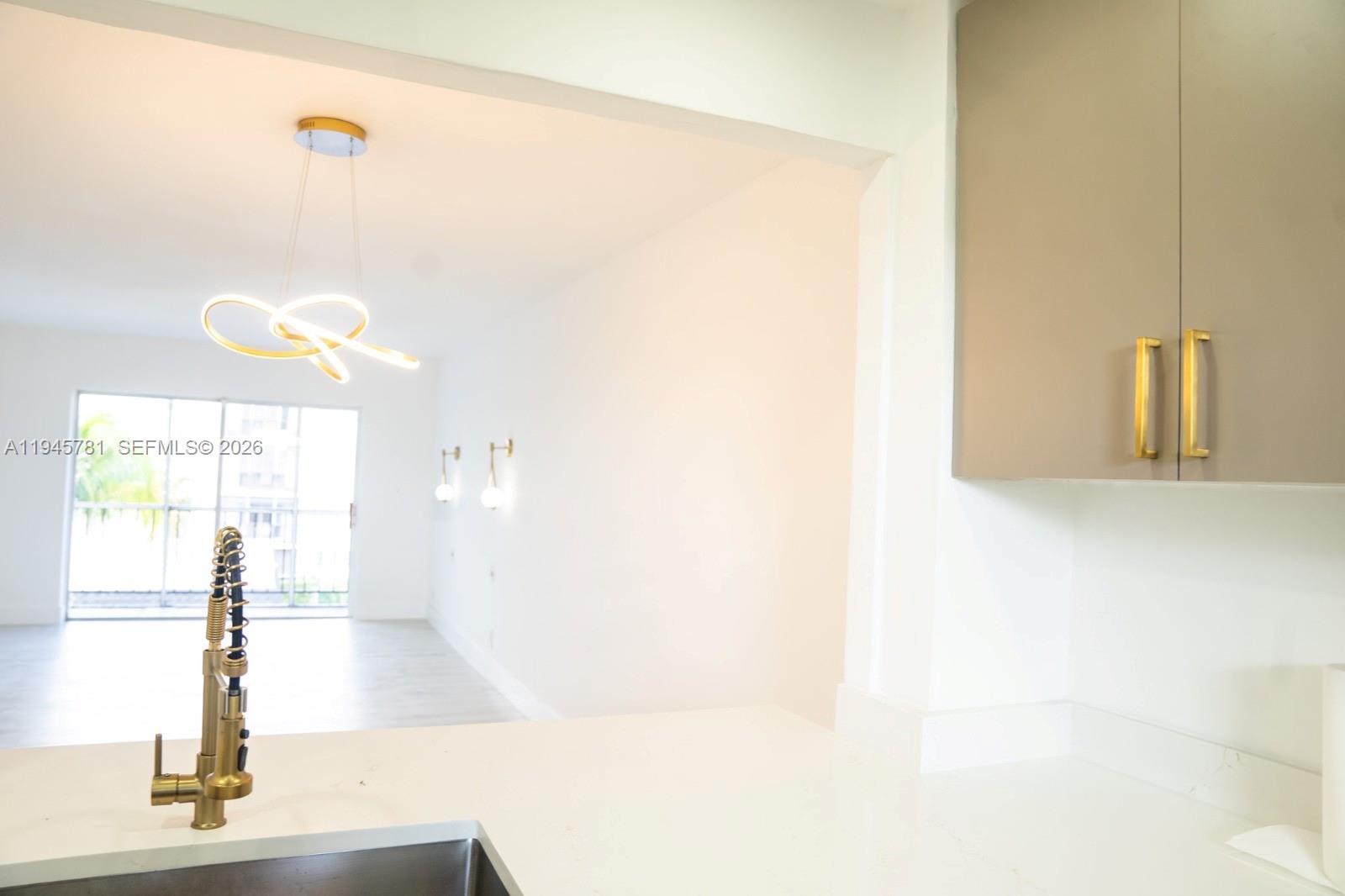 220 Southwest 9th Avenue, Unit 306 Hallandale Beach, FL 33009 - Photo 25 of 30 a view of a living room with a window