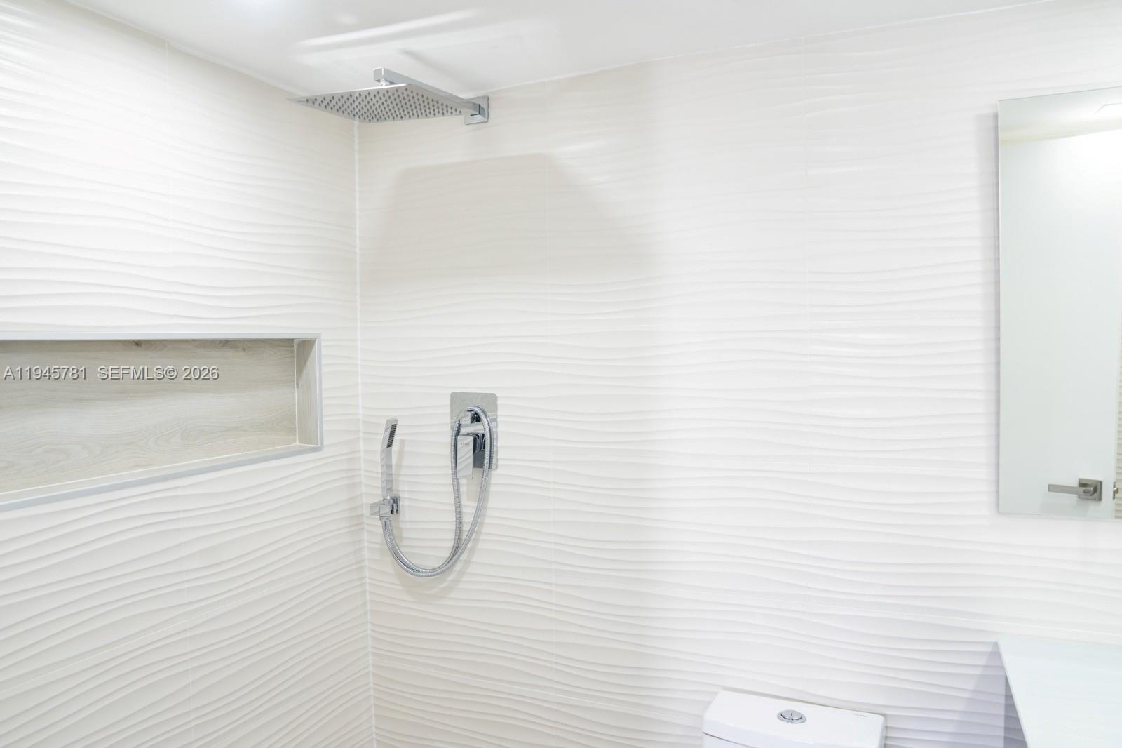 220 Southwest 9th Avenue, Unit 306 Hallandale Beach, FL 33009 - Photo 9 of 30 a bathroom with a shower