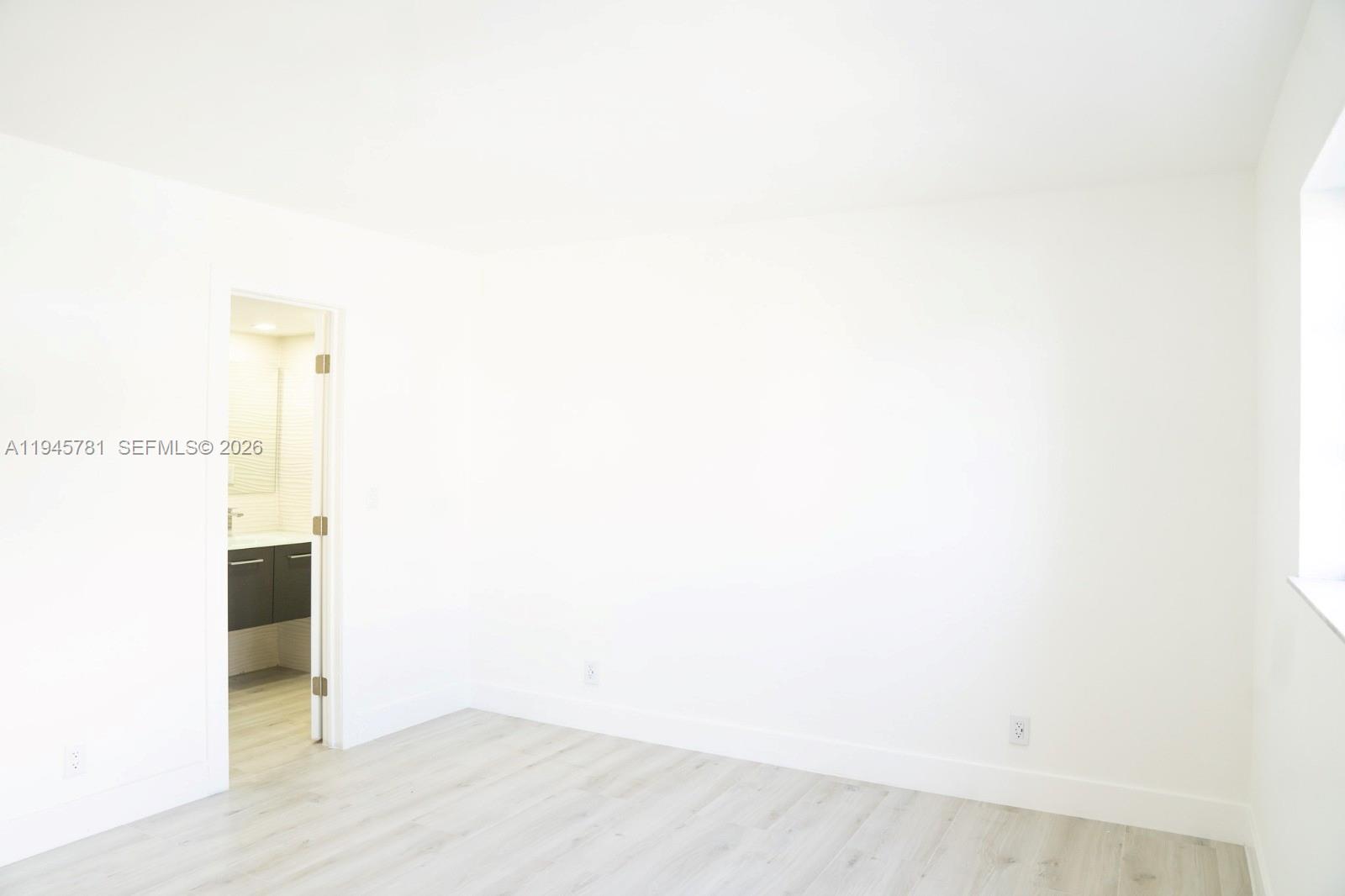 220 Southwest 9th Avenue, Unit 306 Hallandale Beach, FL 33009 - Photo 10 of 30 a view of an empty room