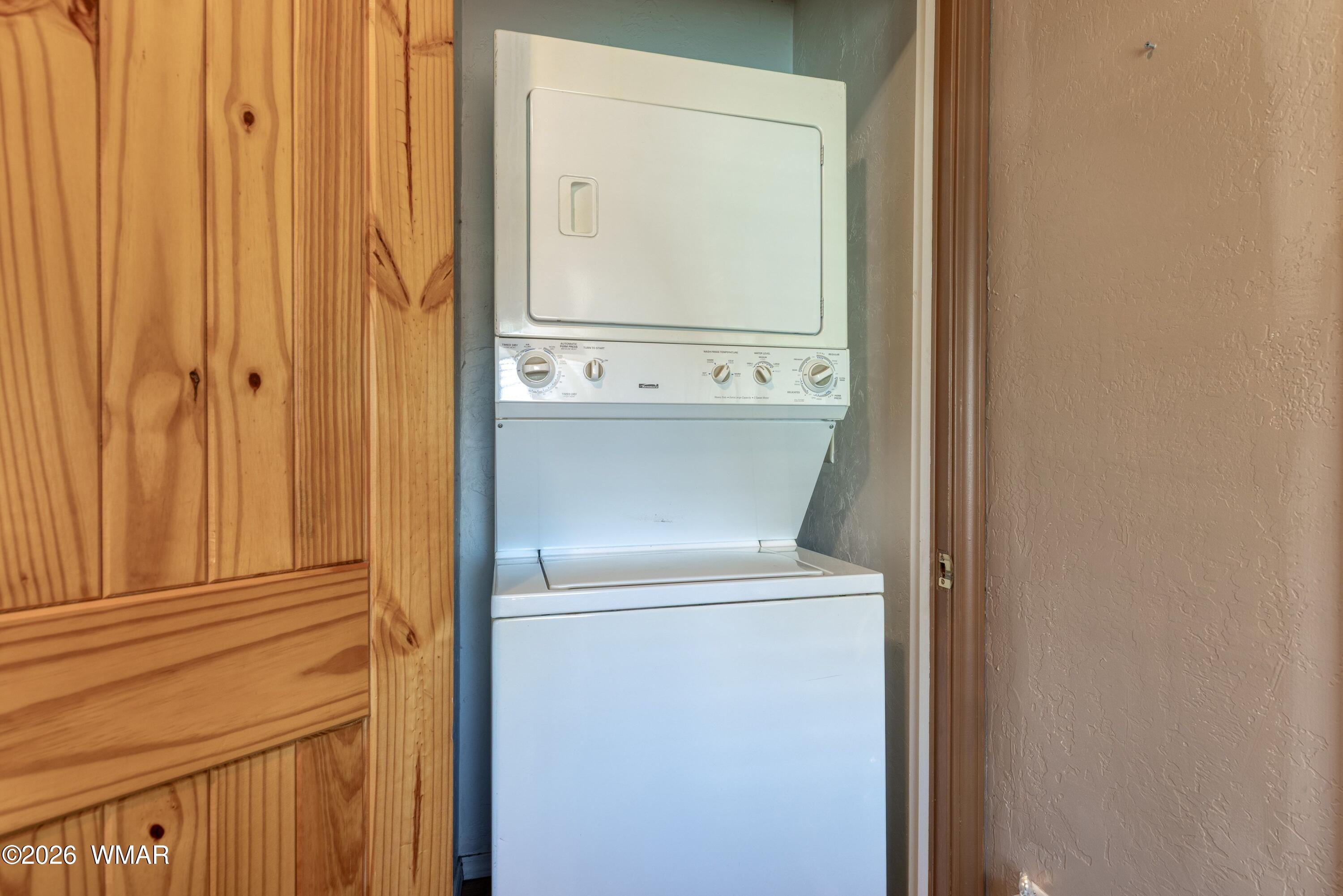 2722 Bain Trail Overgaard, AZ 85933 - Photo 7 of 28 a close view of a utility room with dryer and washer
