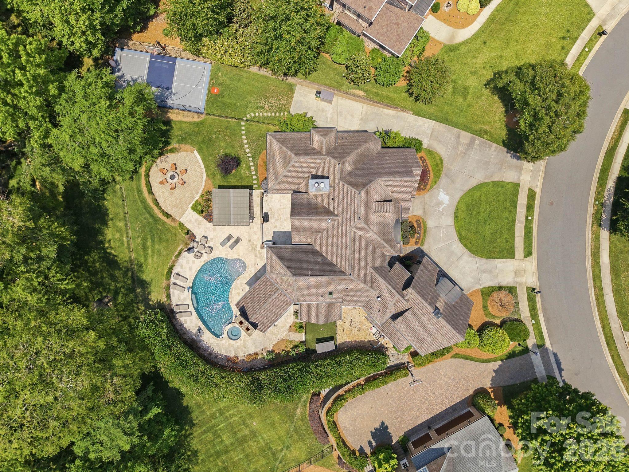 7416 Lee Rea Road Charlotte, NC 28226 - Photo 4 of 48 an aerial view of a house with garden space and swimming pool