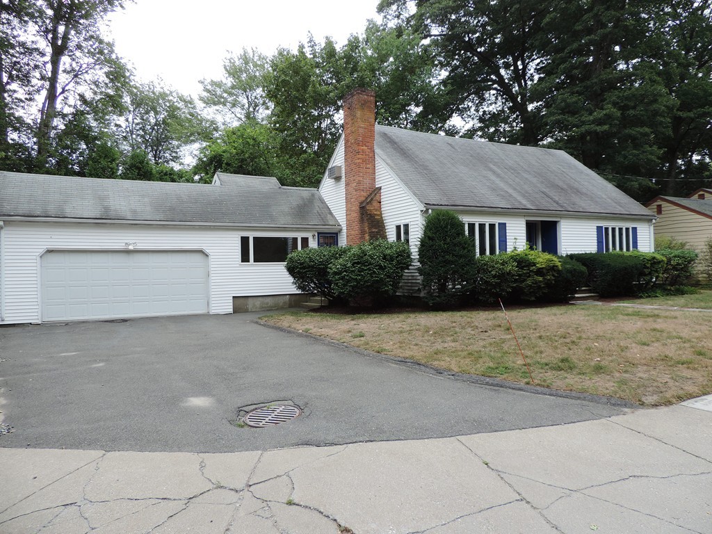4 York Road Newton, MA 02468 - Photo 1 of 7 a front view of a house with a yard and garage