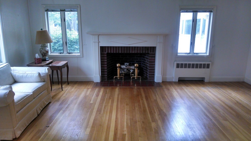 4 York Road Newton, MA 02468 - Photo 2 of 7 a living room with furniture and a fireplace