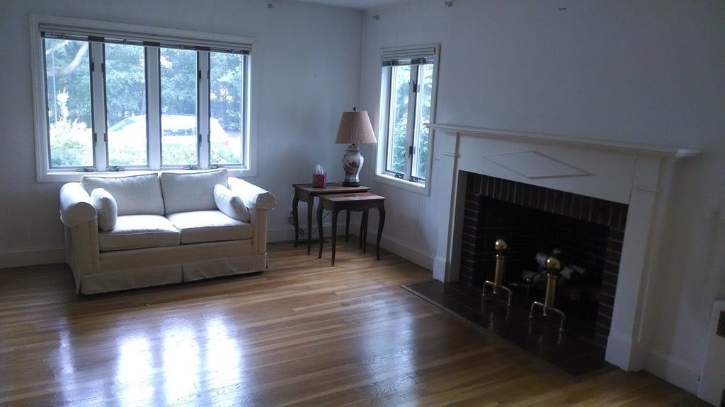 4 York Road Newton, MA 02468 - Photo 3 of 7 a living room with furniture and a fireplace