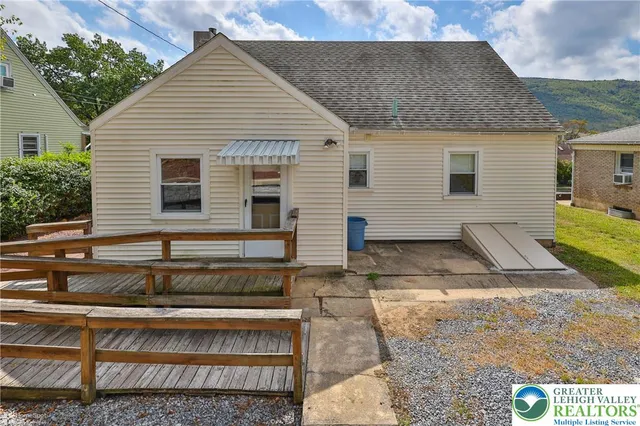 a view of a large garden with large trees