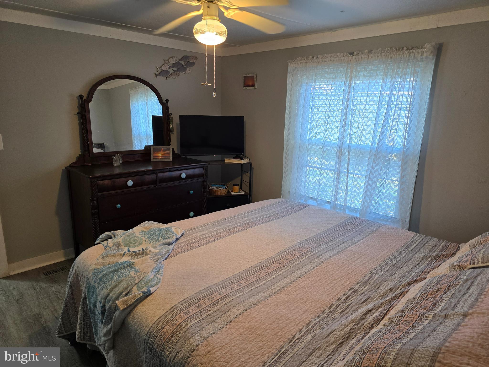 33500 Clover Street Lewes, DE 19958 - Photo 18 of 39 a bedroom with a bed and a flat screen tv