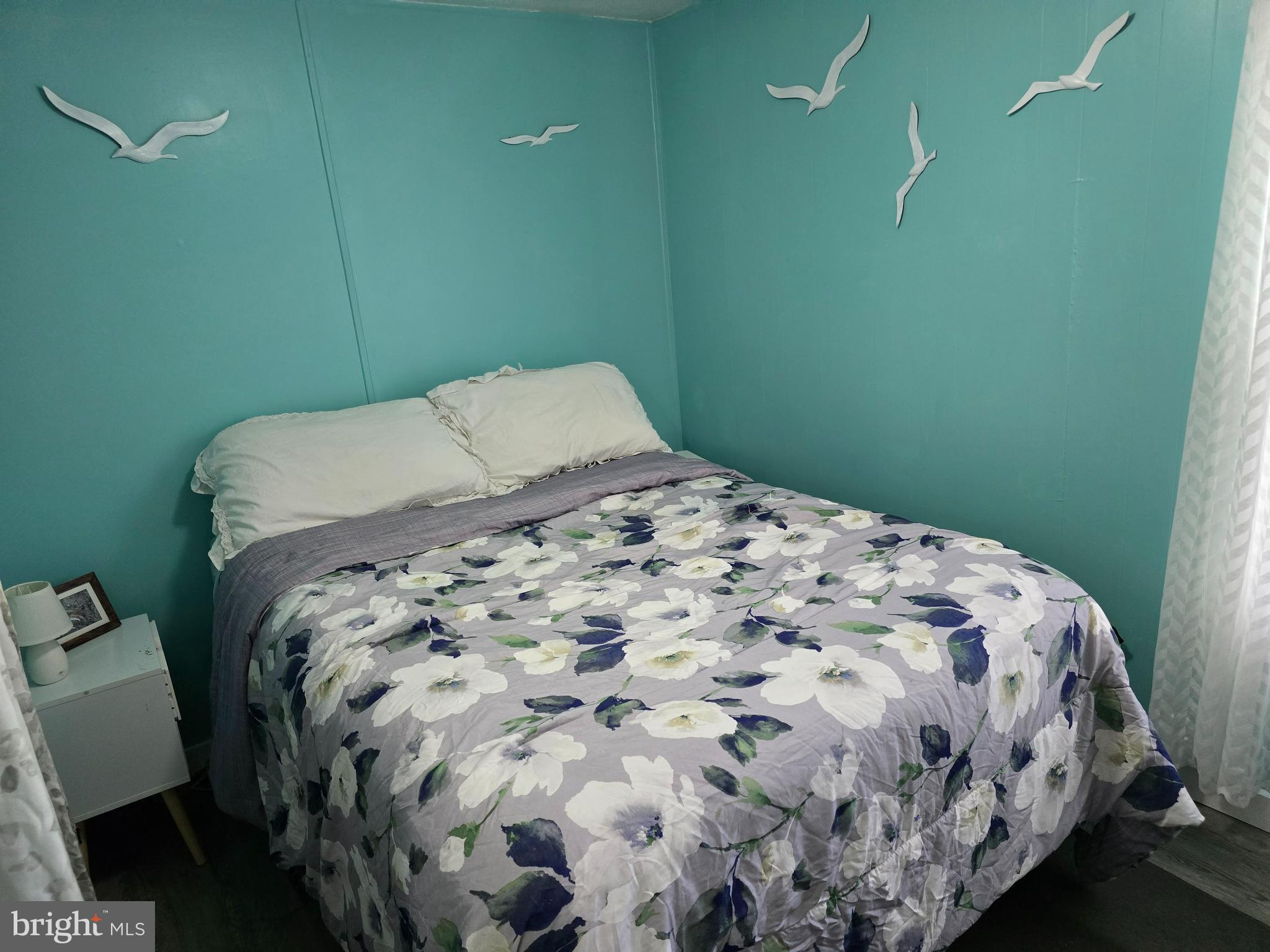 33500 Clover Street Lewes, DE 19958 - Photo 19 of 39 a bed sitting in a bedroom next to a small window