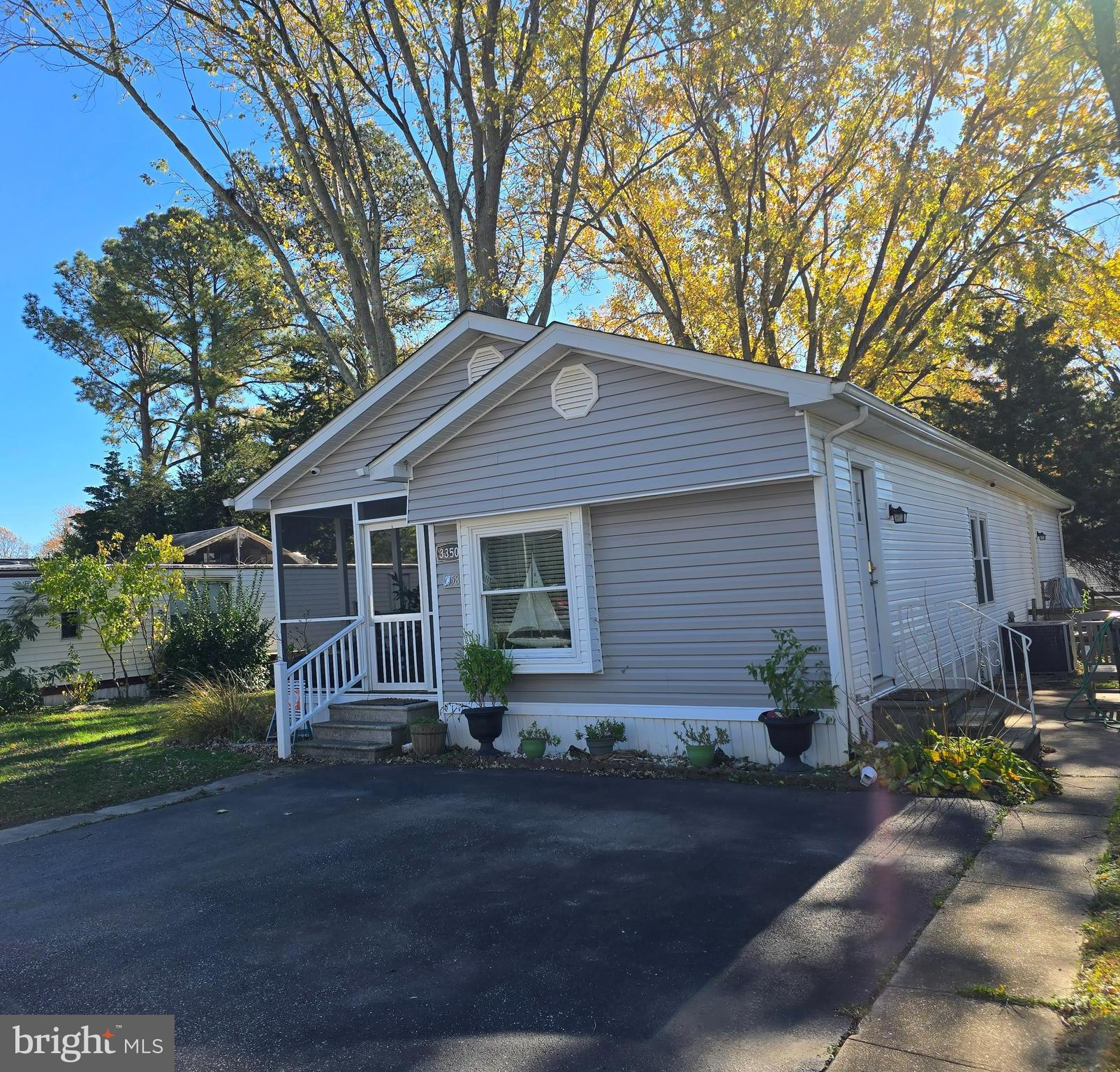 33500 Clover Street Lewes, DE 19958 - Photo 2 of 39 a front view of house with yard and green space