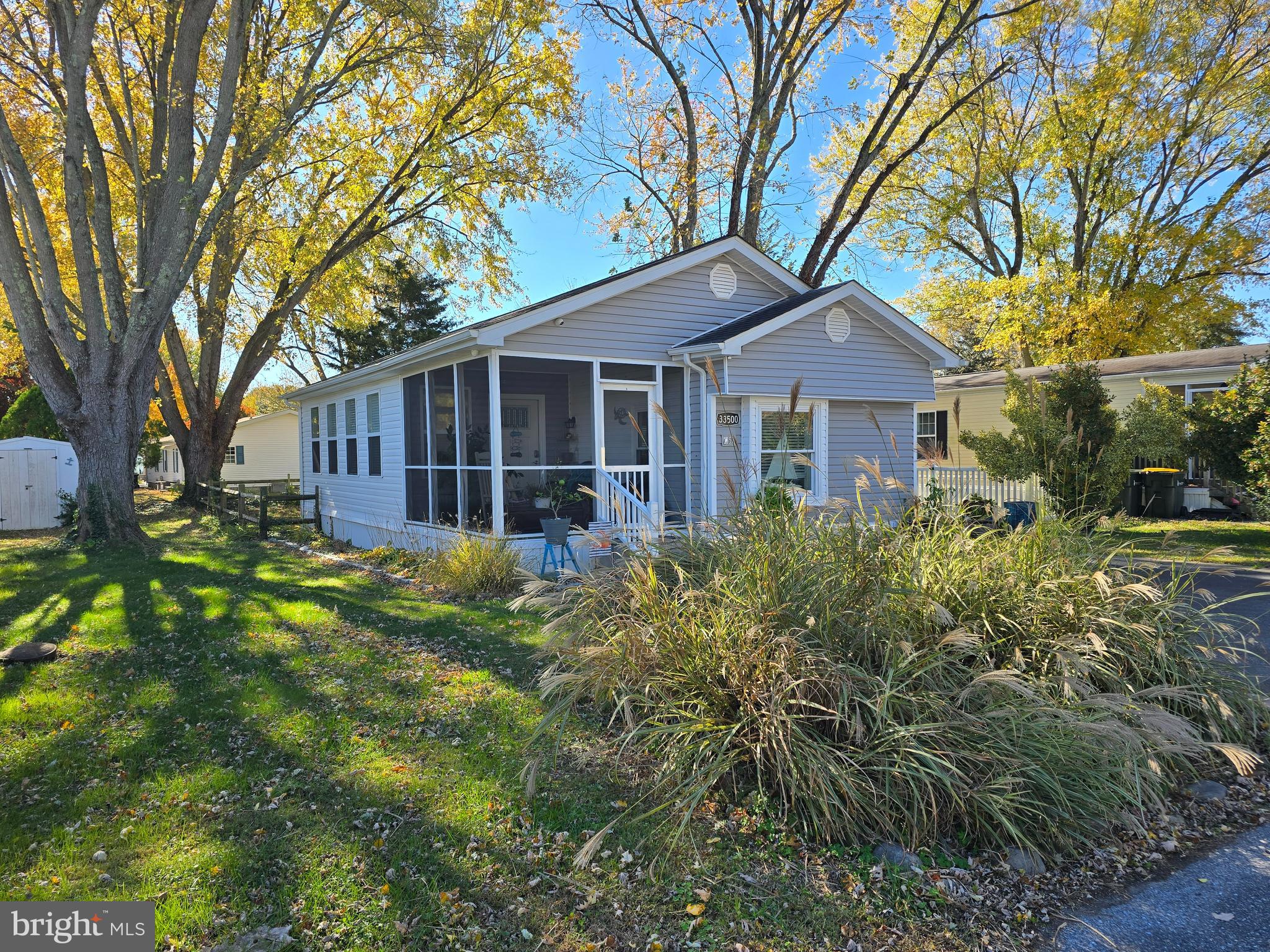 33500 Clover Street Lewes, DE 19958 - Photo 3 of 39 a brick house with trees in front of it