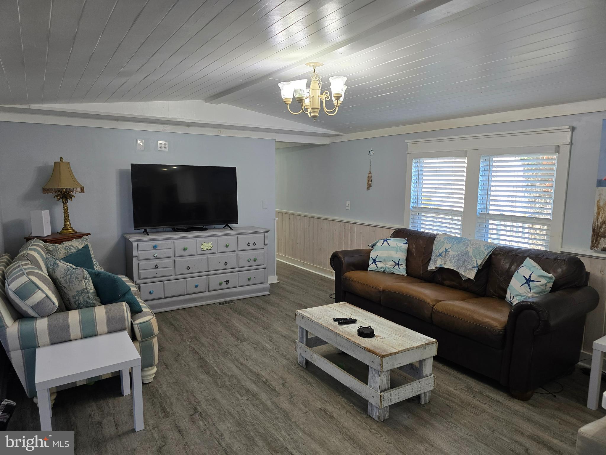 33500 Clover Street Lewes, DE 19958 - Photo 7 of 39 a living room with furniture and a flat screen tv