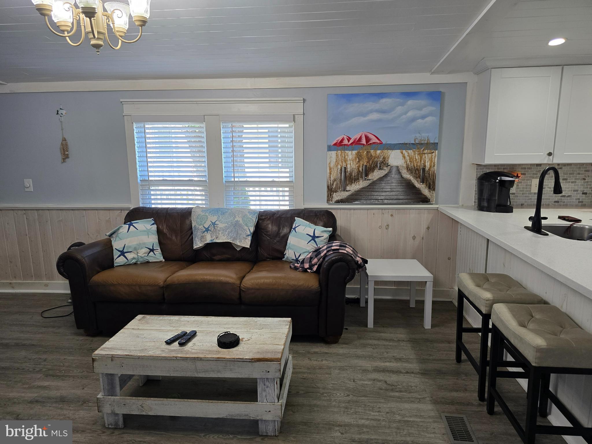 33500 Clover Street Lewes, DE 19958 - Photo 8 of 39 a living room with furniture and a wooden floor