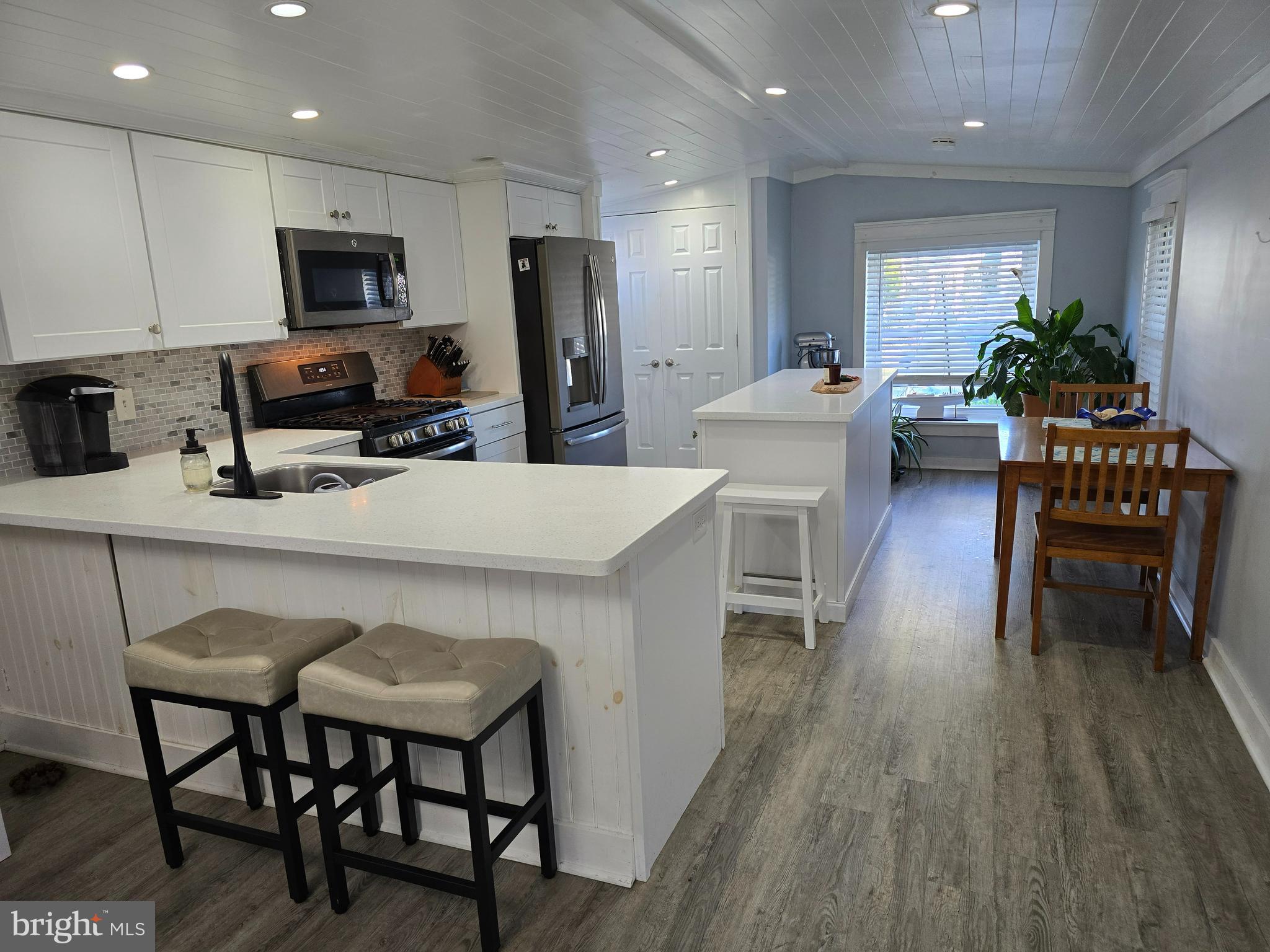 33500 Clover Street Lewes, DE 19958 - Photo 10 of 39 a kitchen with sink a microwave and refrigerator