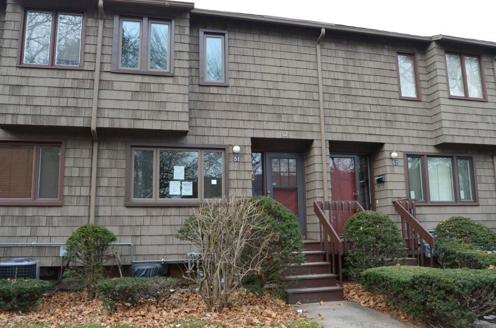 a front view of a house with stairs