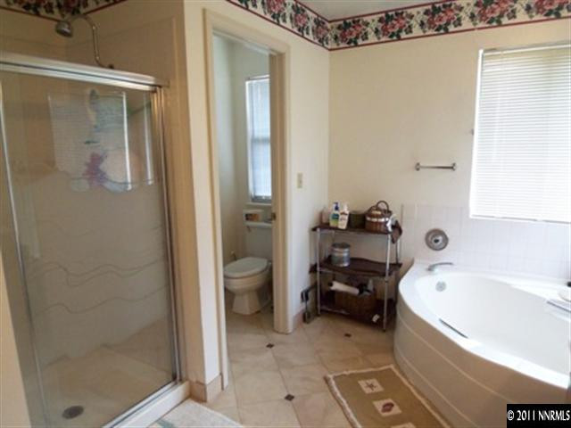 5370 Mountcrest Lane Reno, NV 89523 - Photo 8 of 10 a bathroom with a tub and shower