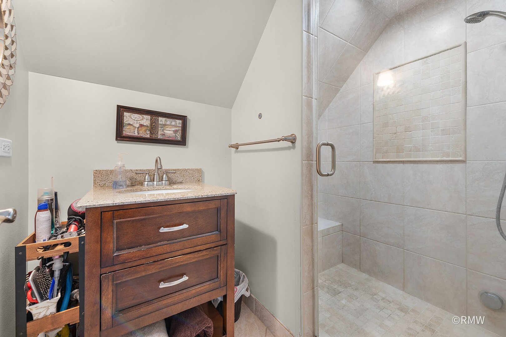 735 Spring Road Elmhurst, IL 60126 - Photo 11 of 34 a bathroom with a sink a vanity and a shower