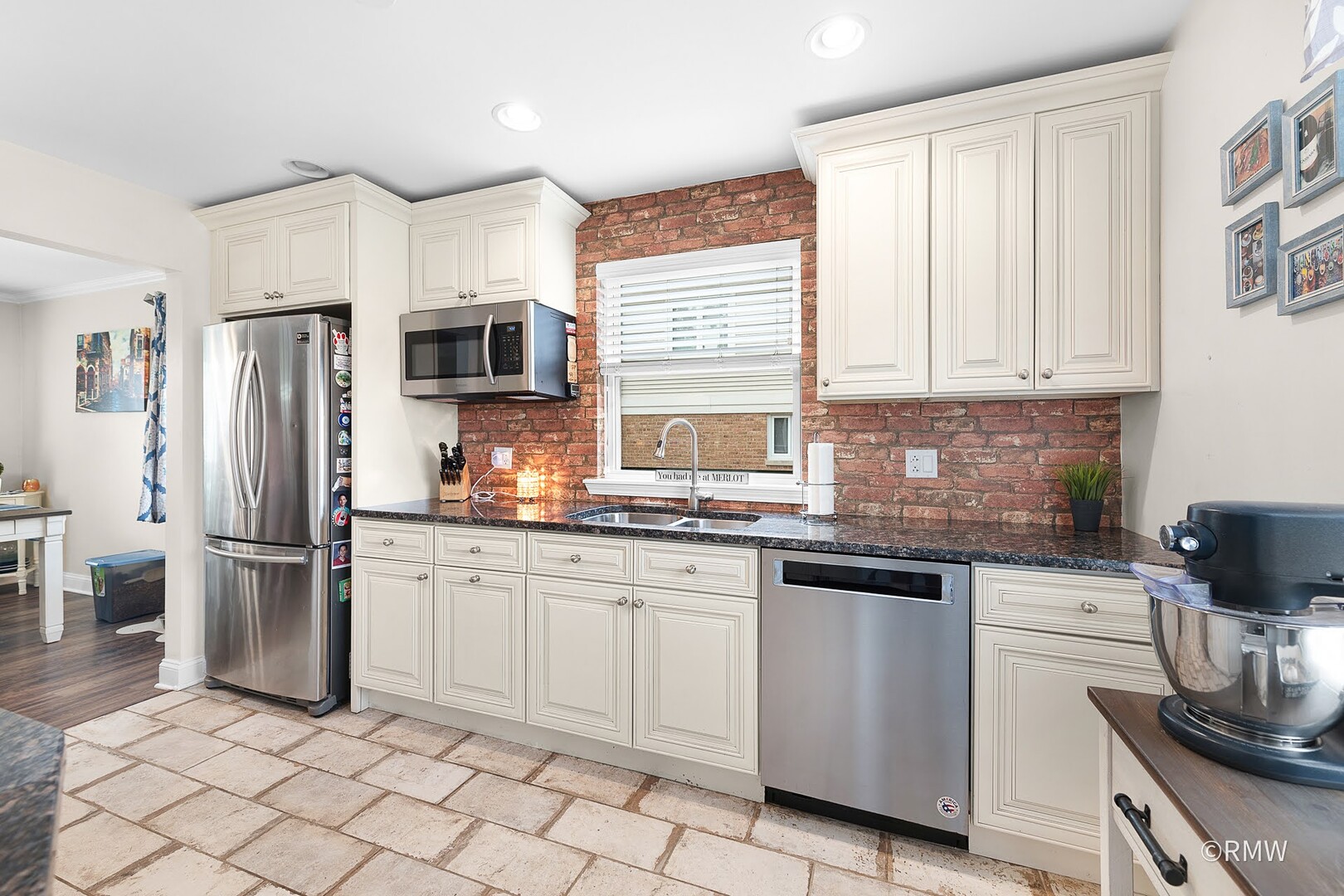 735 Spring Road Elmhurst, IL 60126 - Photo 22 of 34 a kitchen with granite countertop a sink stainless steel appliances and cabinets