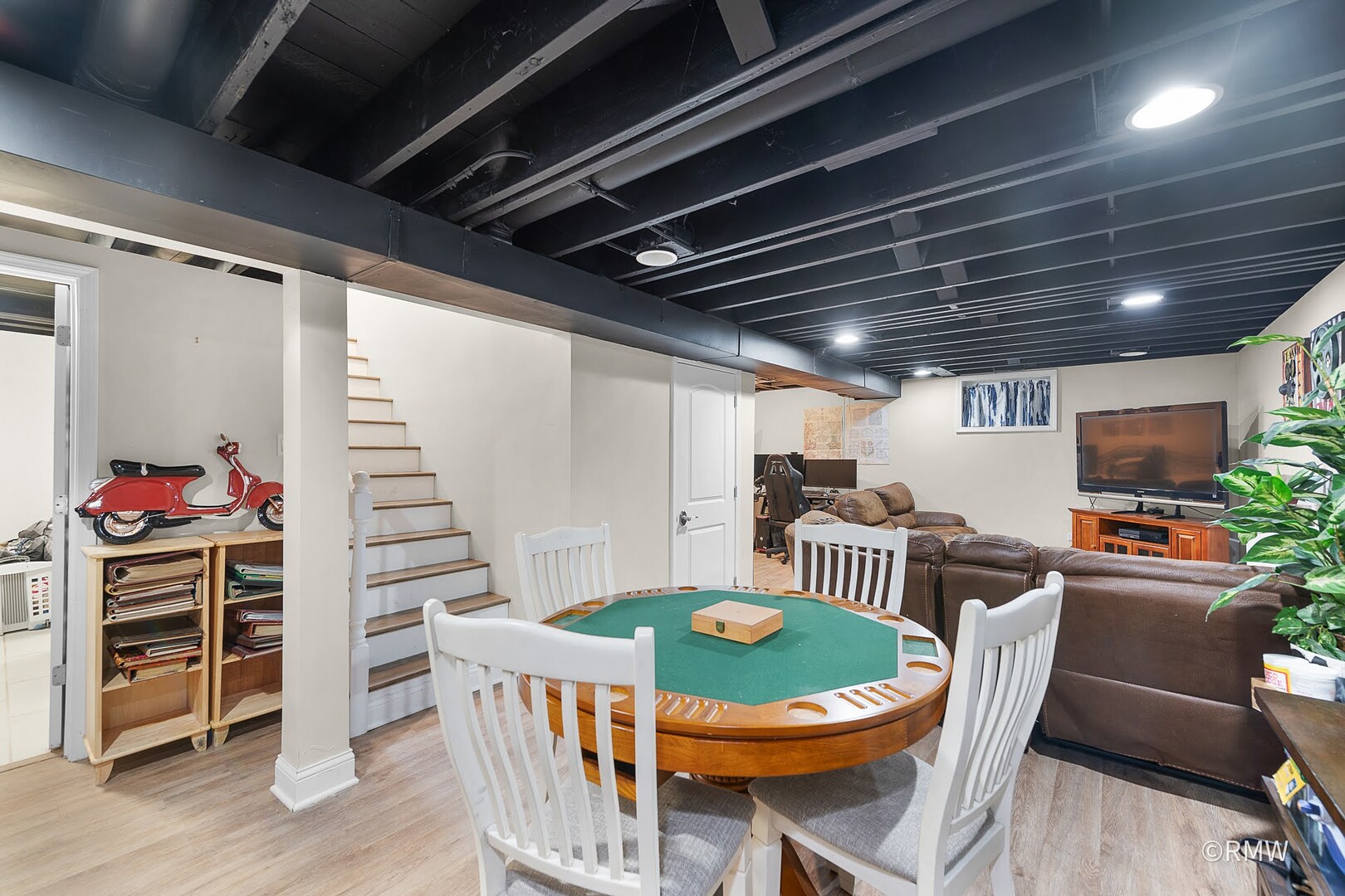 735 Spring Road Elmhurst, IL 60126 - Photo 25 of 34 a dining room with furniture a rug and wooden floor
