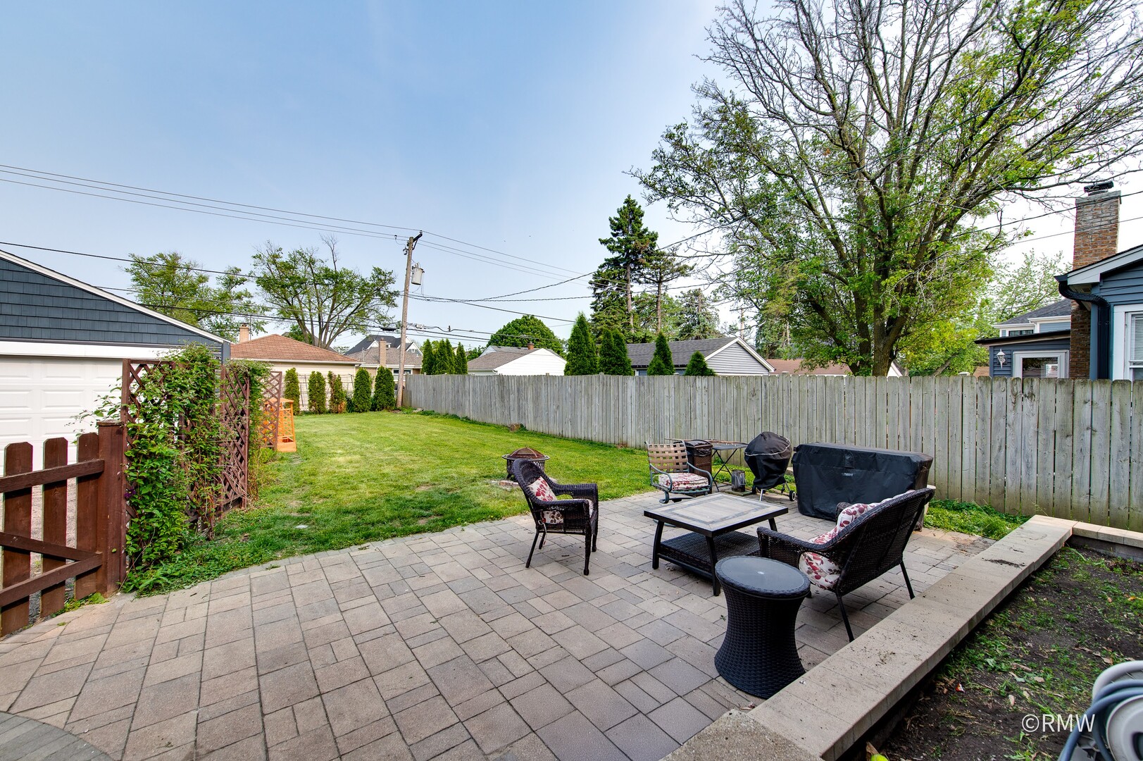 735 Spring Road Elmhurst, IL 60126 - Photo 29 of 34 a view of a chairs and table in the back yard of the house