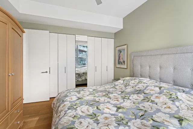 a bathroom with a double vanity sink a mirror and a bathtub