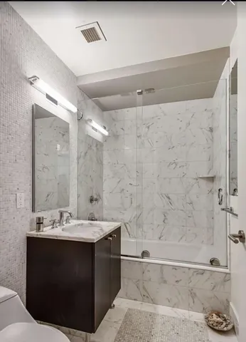 a bedroom with a large bed and closet