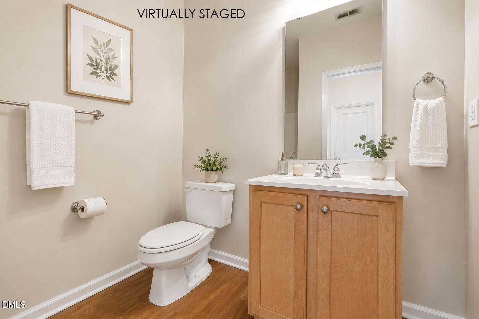 801 Moratuck Drive, Unit 202 Raleigh, NC 27604 - Photo 18 of 23 a bathroom with a sink toilet and a mirror