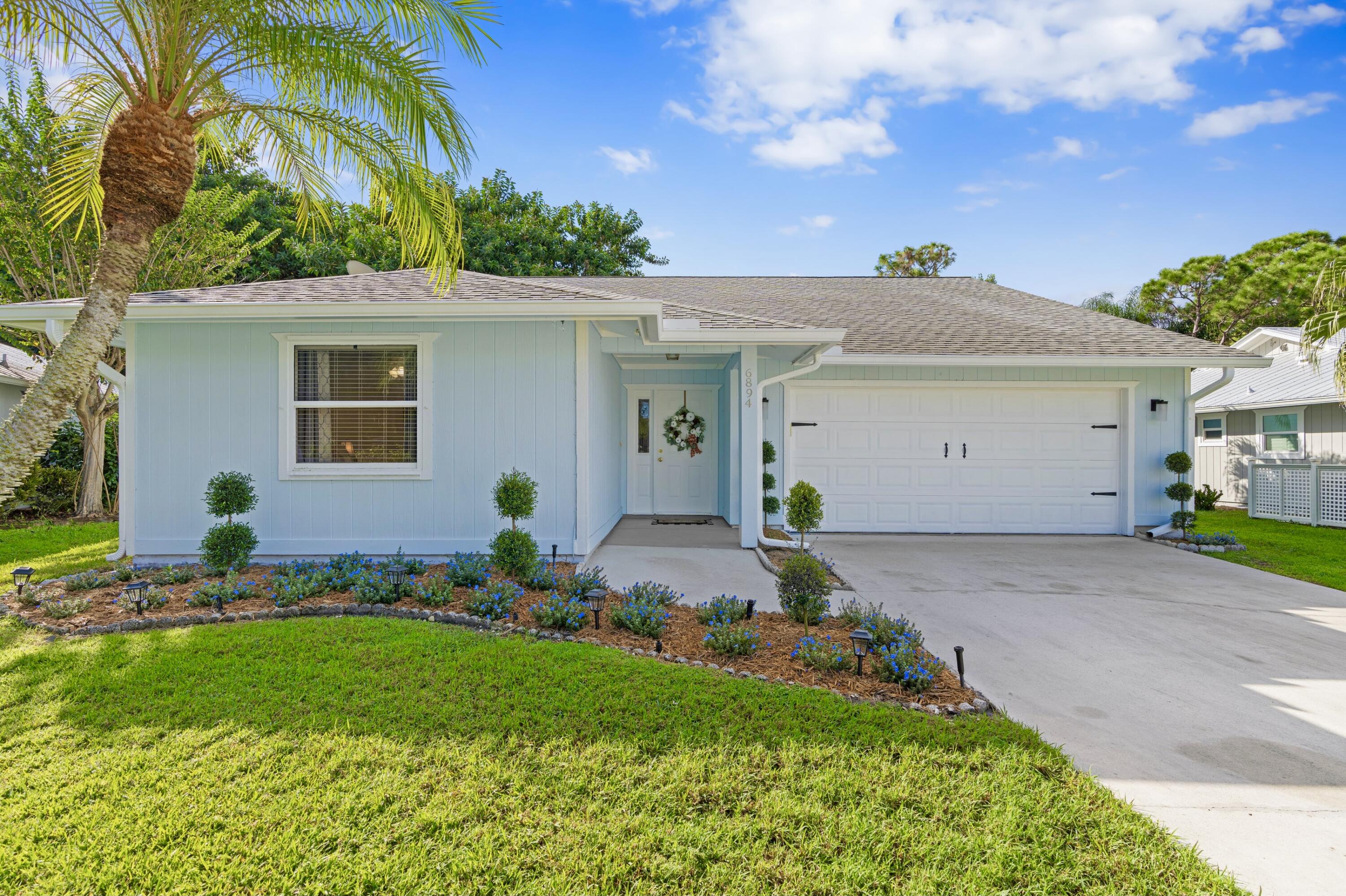 6894 Southeast Raintree Avenue Stuart, FL 34997 - Photo 1 of 24 Freshly Painted Exterior